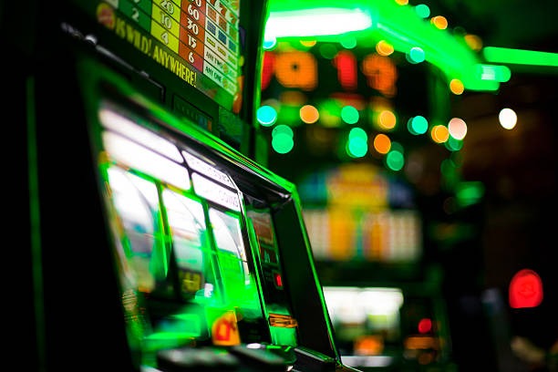 qqdewatoto platform showing Sic Bo alongside other games like slots and football betting
